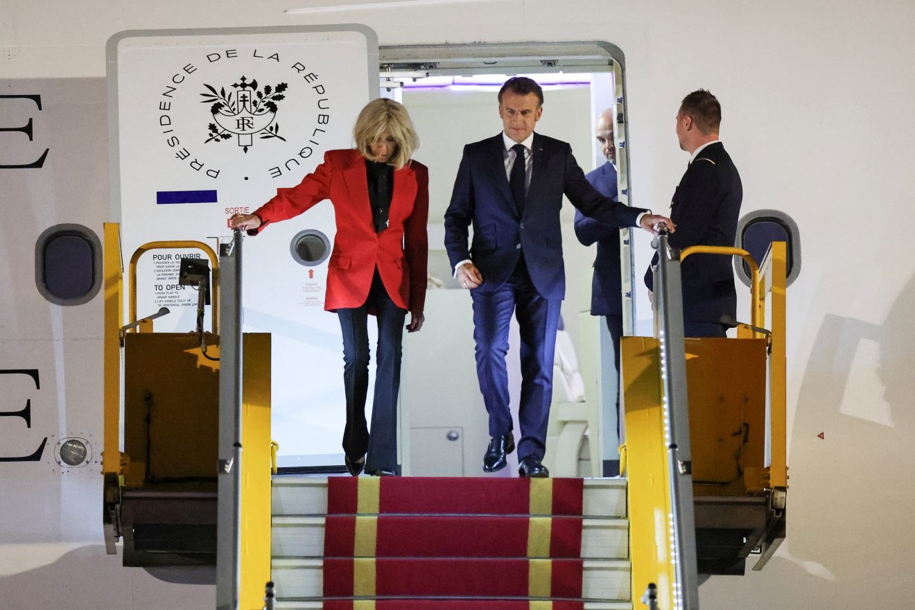 French President Macron downplays seeming push from wife during Vietnam visit
